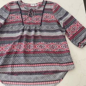 Women’s Kim Roger’s 3/4 sleeve high low top.